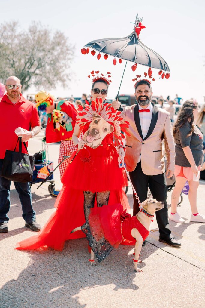 pup and owners in ball costume