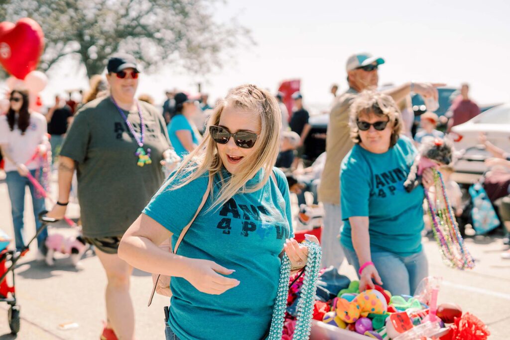 photo of people handing out beads